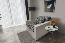 Fábia ágyneműtartós fotelágy ezüst serlegszürke szövet