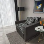 Fábia ágyneműtartós fotelágy kvarcszürke szövet