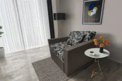 Fábia ágyneműtartós fotelágy mély földszürke szövet