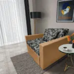 Fábia ágyneműtartós fotelágy okker szövet