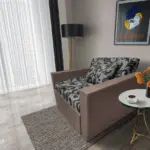 Fábia ágyneműtartós fotelágy pasztell taupe szövet