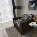 Fábia ágyneműtartós fotelágy sötét mahagóni szövet