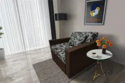 Fábia ágyneműtartós fotelágy sötét mahagóni szövet