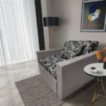 Fábia ágyneműtartós fotelágy szamárszürke szövet