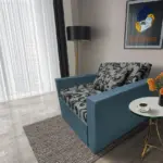 Fábia ágyneműtartós fotelágy szürkés kadét szövet