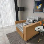 Fáni ágyneműtartós fotelágy okker szövet