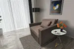 Mama ágyneműtartós fotelágy mély földszürke pasztell taupe színben