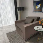 Mama ágyneműtartós fotelágy pasztell taupe mély földszürke színben